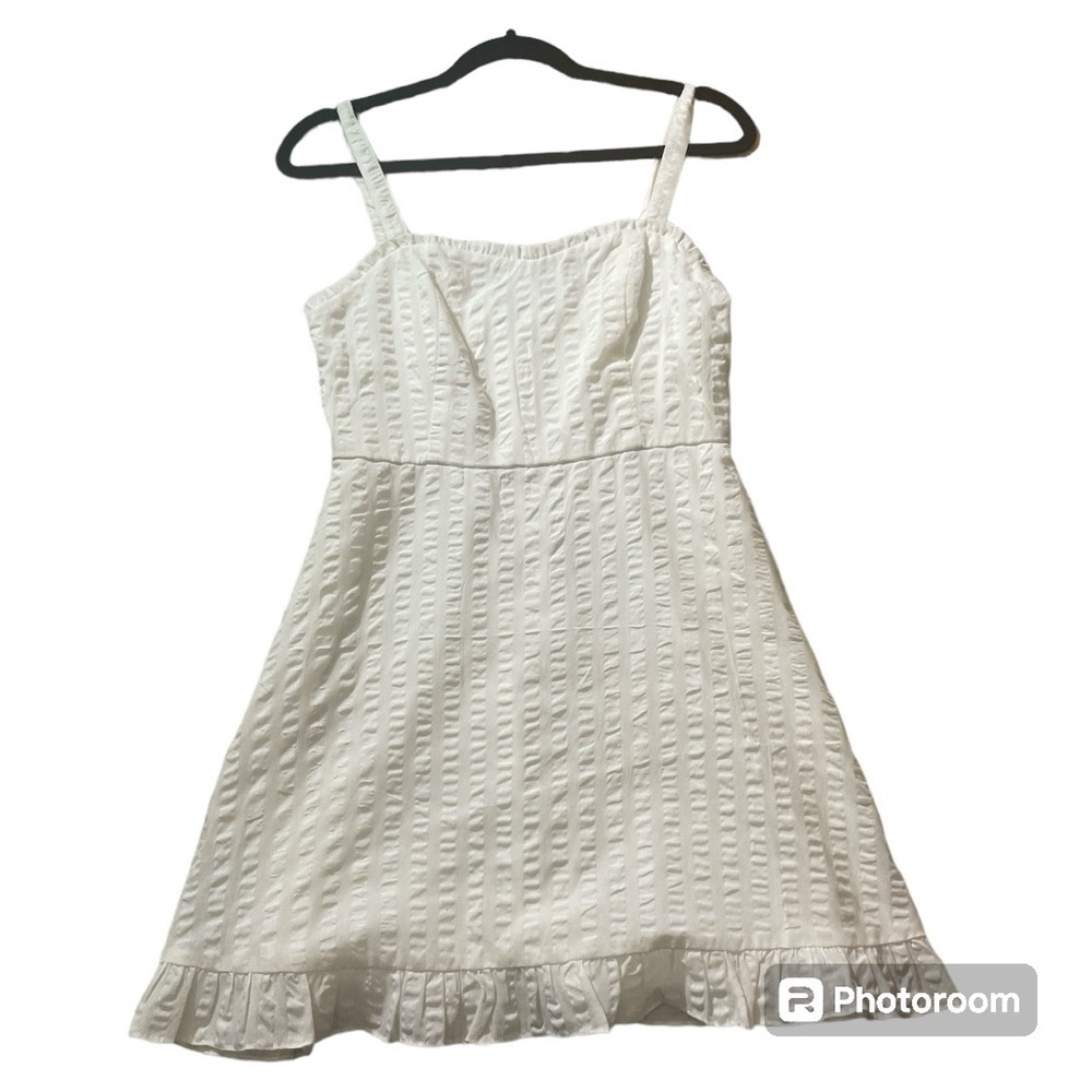 Speechless White feminine seersucker dress with ruffle accents.